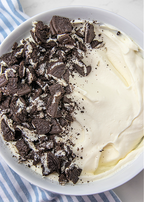 crushed oreo and whipped cream in a bowl
