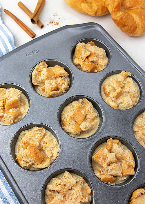 French Toast Muffins are delicious and easy to bake! Cinnamon and croissants combine for mega flavor in a convenient muffin-size serving! french toast in a muffin tin