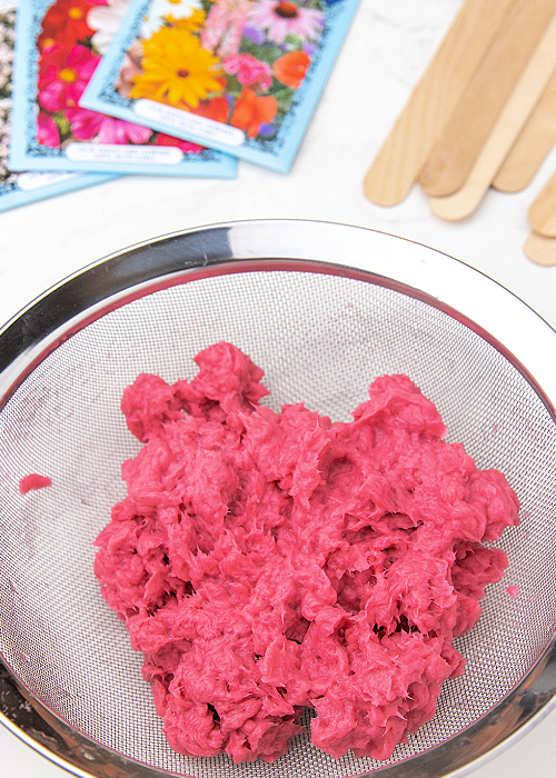 pulpy paper in a strainer