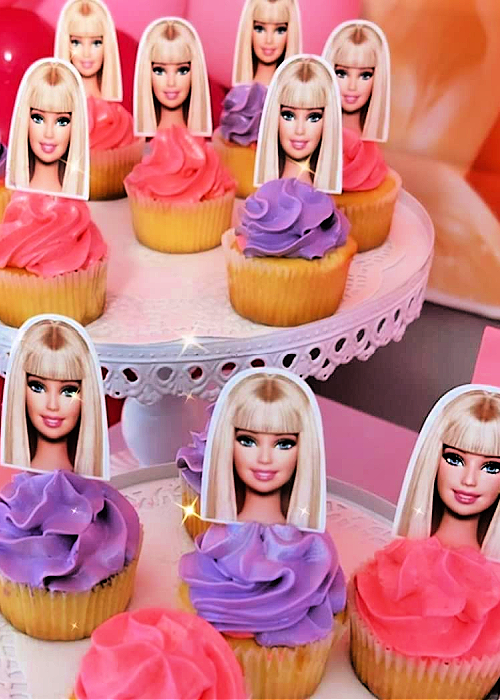 We've pulled together the BEST of Barbie Party Ideas for all occasions! From backdrops to desserts, the CUTEST ideas for your inspiration! pink and purple barbie cupcakes on a platter