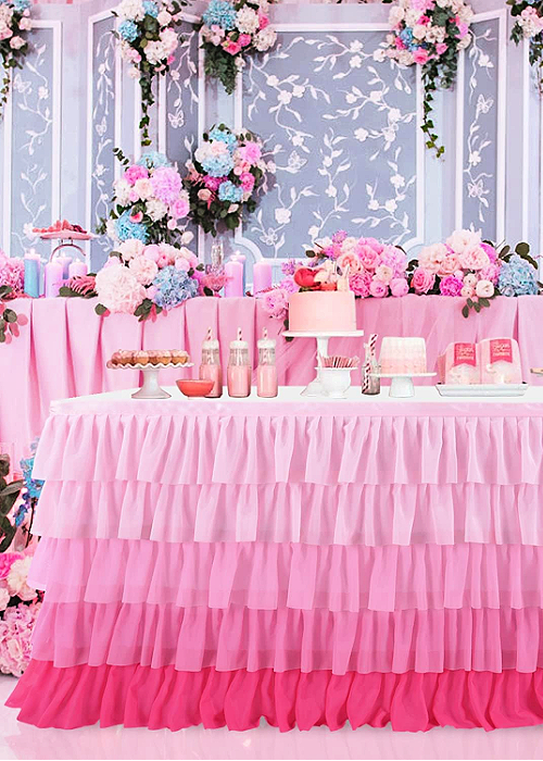 We've pulled together the BEST of Barbie Party Ideas for all occasions! From backdrops to desserts, the CUTEST ideas for your inspiration! ruffled pink ombre tablecloth for a barbie party