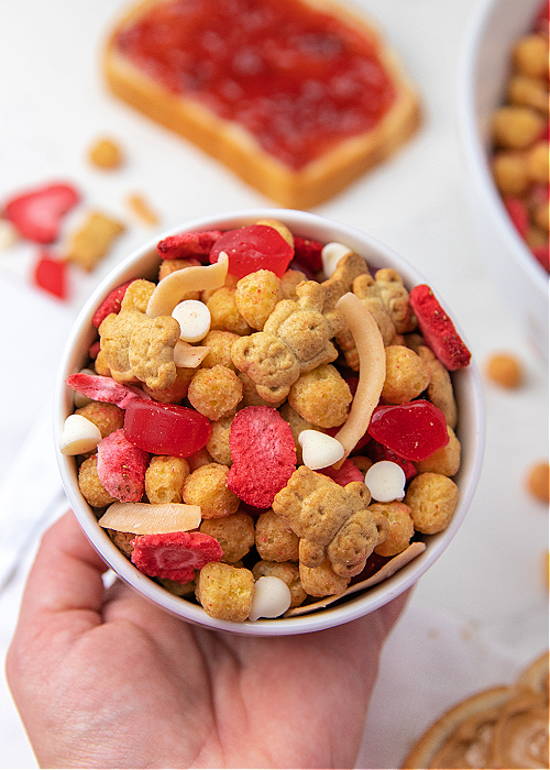 holding a bowl of trail mix