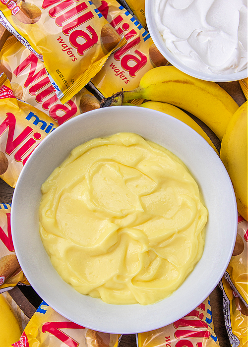 pudding in a bowl on a walking banana pudding board