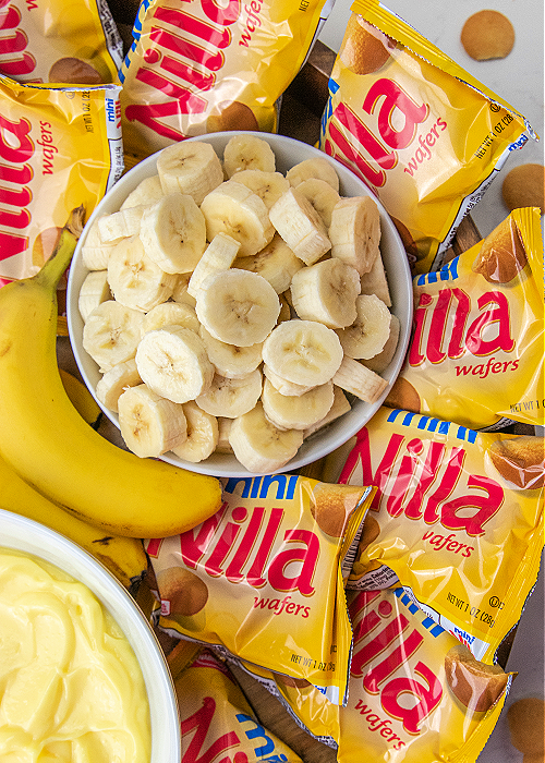 sliced bananas in a bowl on a banana pudding diy board
