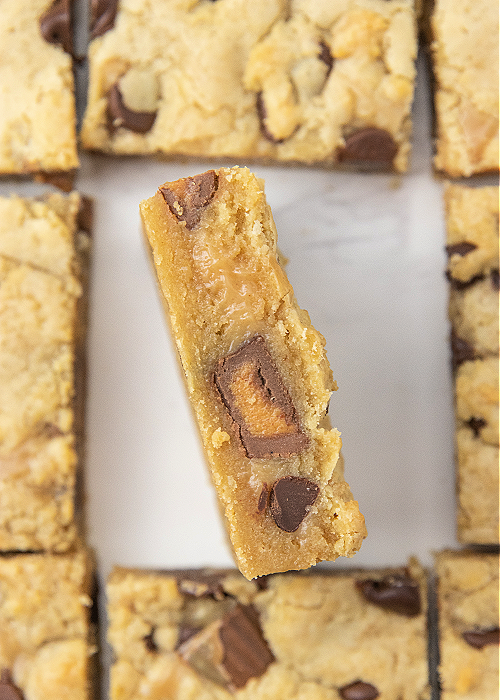 the inside of a peanut butter cup gooey cookie bar