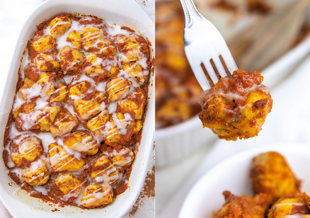 a pumpkin cinnamon roll casserole in a white pan