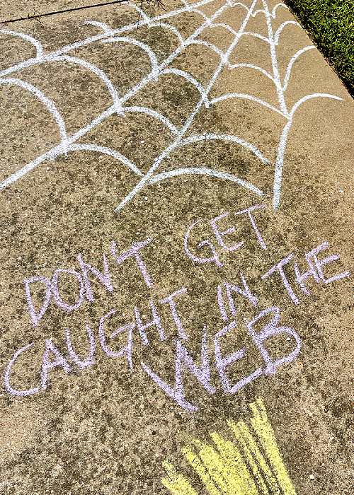 chalk spiderweb in halloween obstacle course