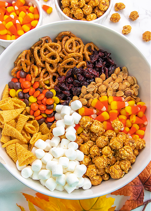 turkey snack mix ingredients in a white mixing bowl