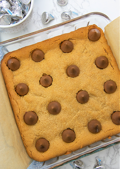 peanut butter blossom bars in a baking dish