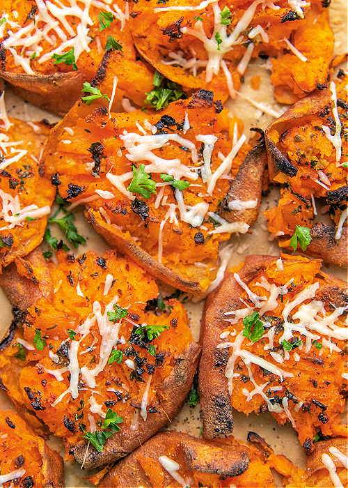 These Garlic Parmesan Smashed Sweet Potatoes are the perfect modern addition to your Thanksgiving meal or any dinner, for that matter! garlic parmesan smashed sweet potatoes