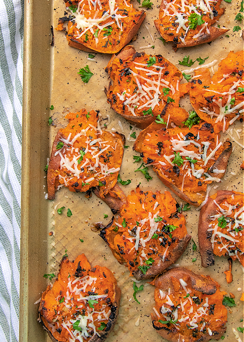These Garlic Parmesan Smashed Sweet Potatoes are the perfect modern addition to your Thanksgiving meal or any dinner, for that matter! garlic parmesan smashed sweet potatoes