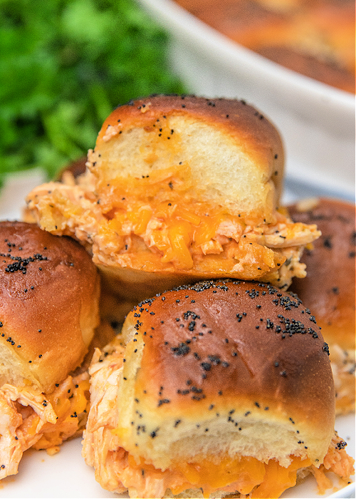 buffalo chicken sliders stacked on a serving platter
