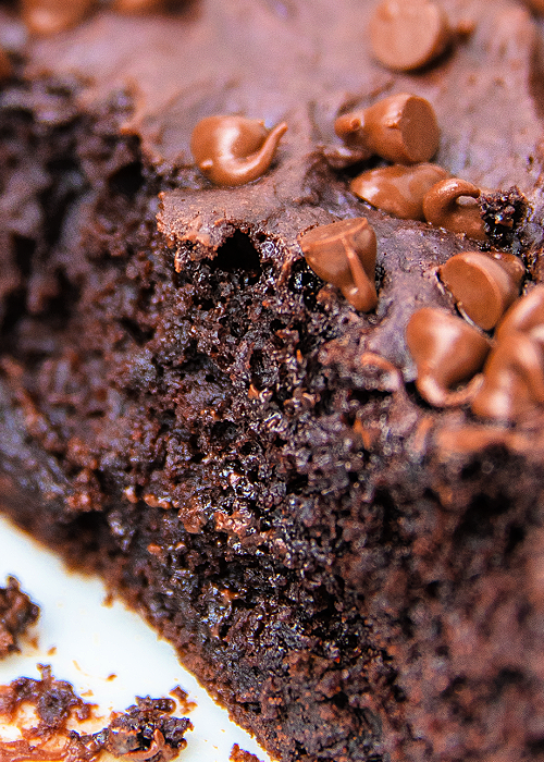 a slice of quadruple chocolate lazy cake in the cake pan