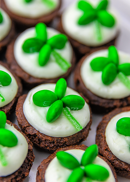 Shamrock M&M Brownie Bites are easy to make and so festive for St. Patrick's Day! Place the candy and you're done decorating! closeup of shamrock M&M brownie Bites