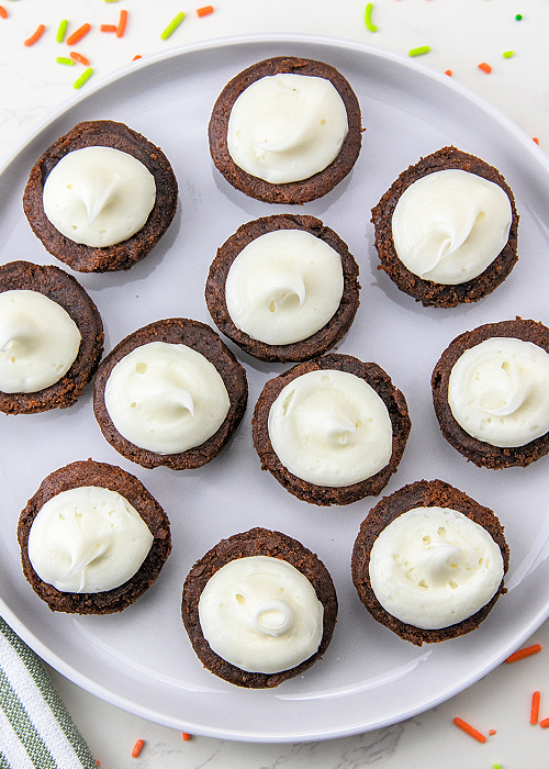 Shamrock M&M Brownie Bites are easy to make and so festive for St. Patrick's Day! Place the candy and you're done decorating! instructions for how to make shamrock brownie bites