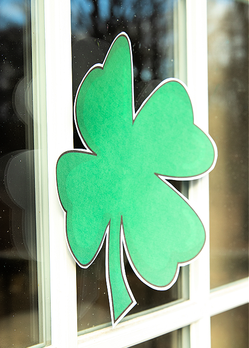 green paper shamrock on a window