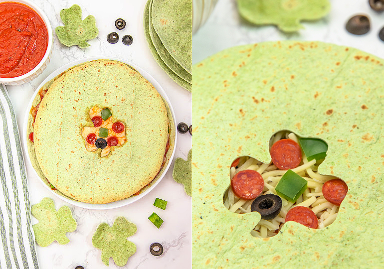 shamrock pizza quesadilla on a white plate with pizza toppings inside