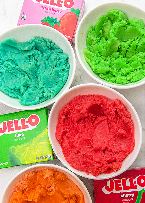 brightly colored jello cookie dough in white small dishes