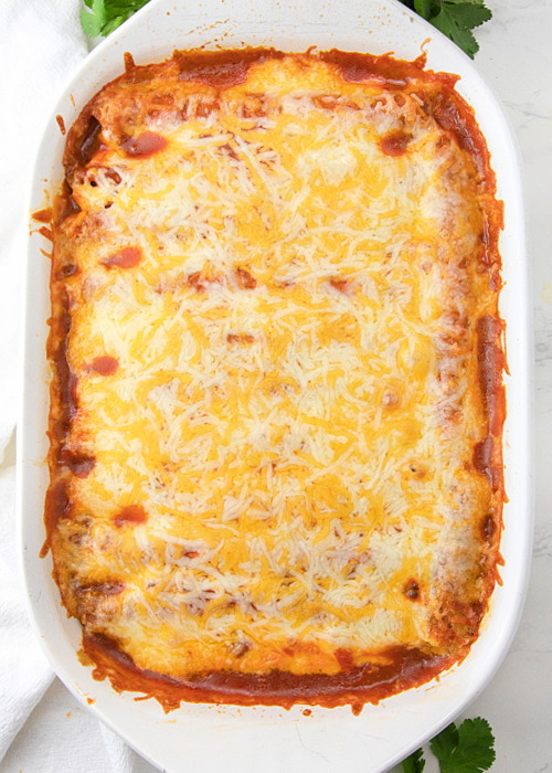 just baked lazy enchilada casserole with melted cheese on top