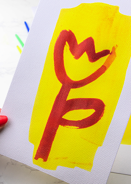 This No-Heat Invisible Ink Activity for Kids combines several common household items and works perfectly with BRIGHT color every time! a picture of a flower drawn with invisible ink that turned purple when the yellow solution was applied to it