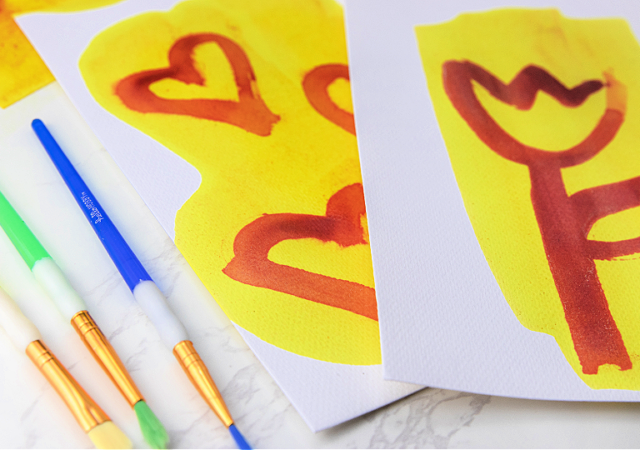 purple ink is revealed by a yellow solution on white paper