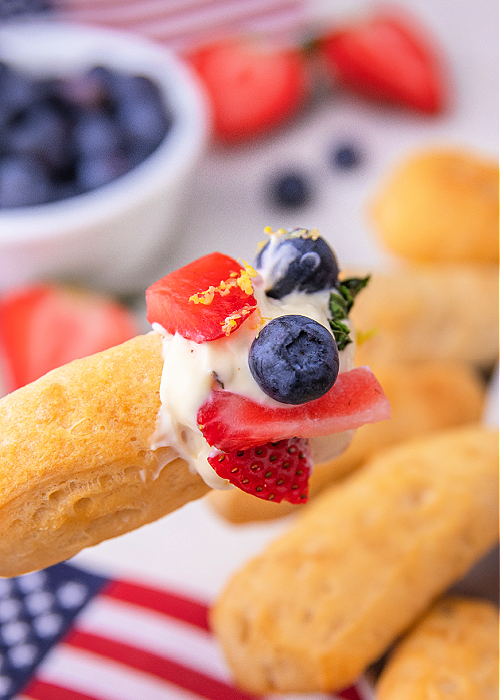 shortcake dipper with patriotic cheesecake dip on it