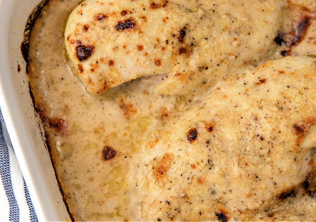 4 ingredient caesar chicken in a white baking dish