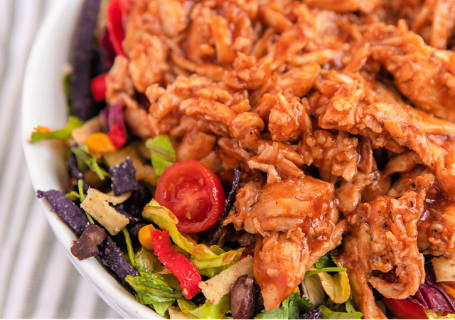 bbq chicken chopped salad in a white serving bowl