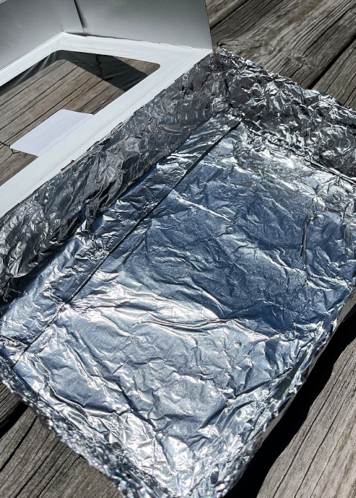 foil lined solar oven made with a donut box