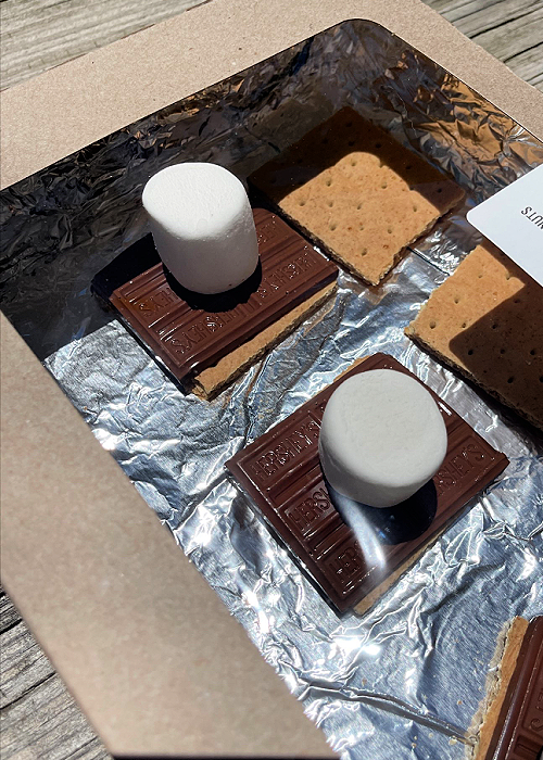 s'mores being cooked in a diy solar oven