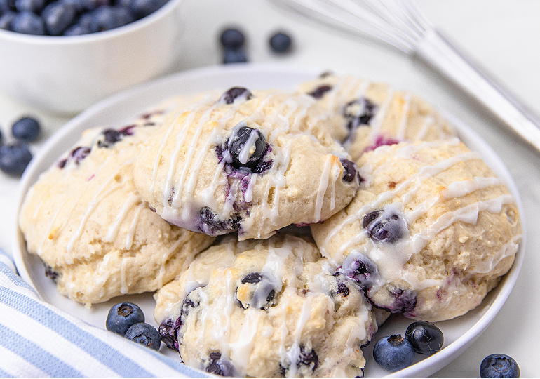 4 Ingredient Blueberry Biscuits piled on a white serving platter
