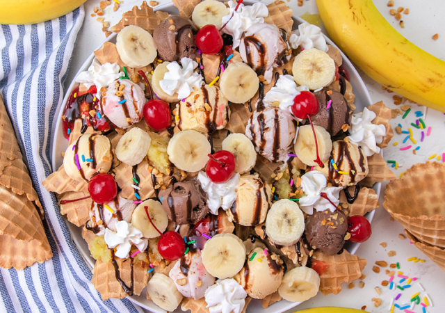 banana split dessert nachos on a white serving tray