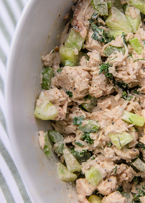 easy cucumber dill chicken salad in a white serving dish