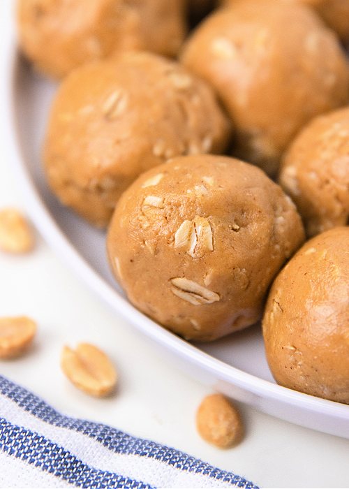 peanut butter balls on a white serving platter