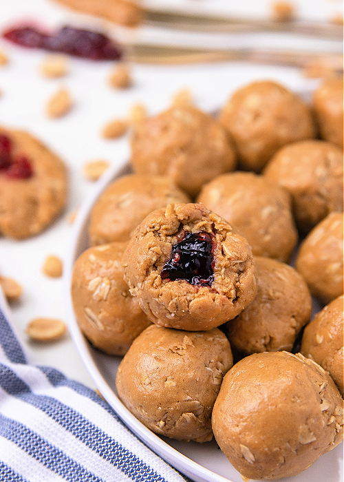 peanut butter and jelly protein bites on a white serving platter