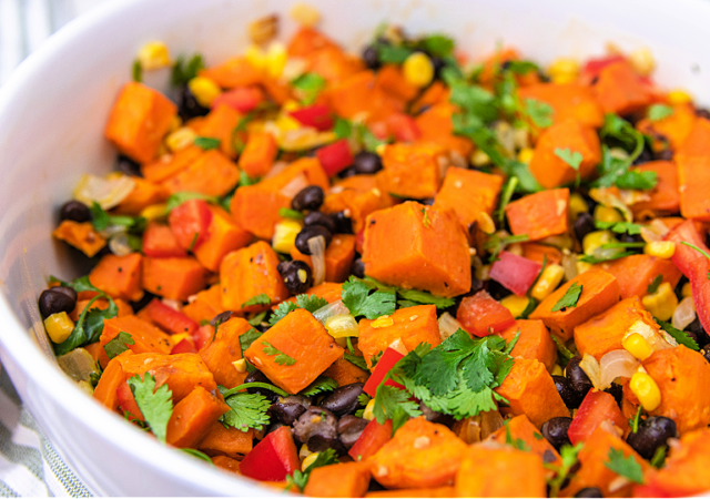 sweet potato salad in a white serving bowl