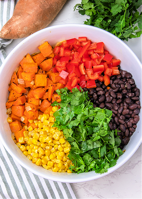ingredients for sweet potato salad in a large mixing bowl
