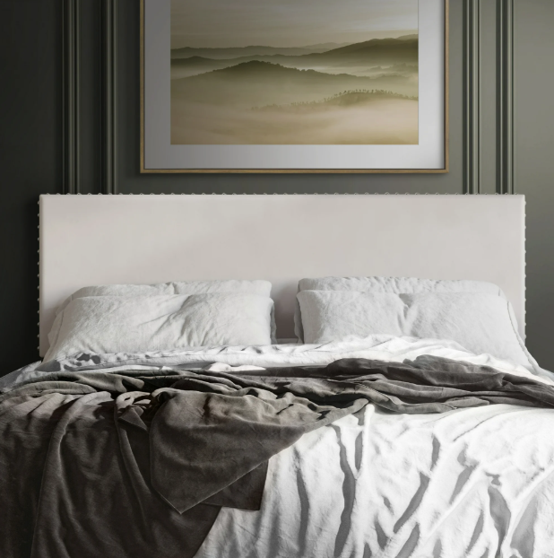velvet upholstered headboard with nail trim