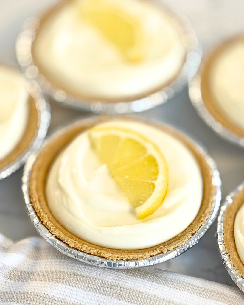 3-ingredient no bake cheesecake with a lemon slice on top