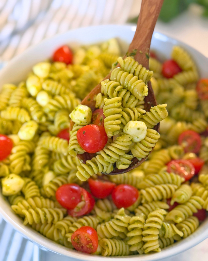 serving spoon full of pasta salad