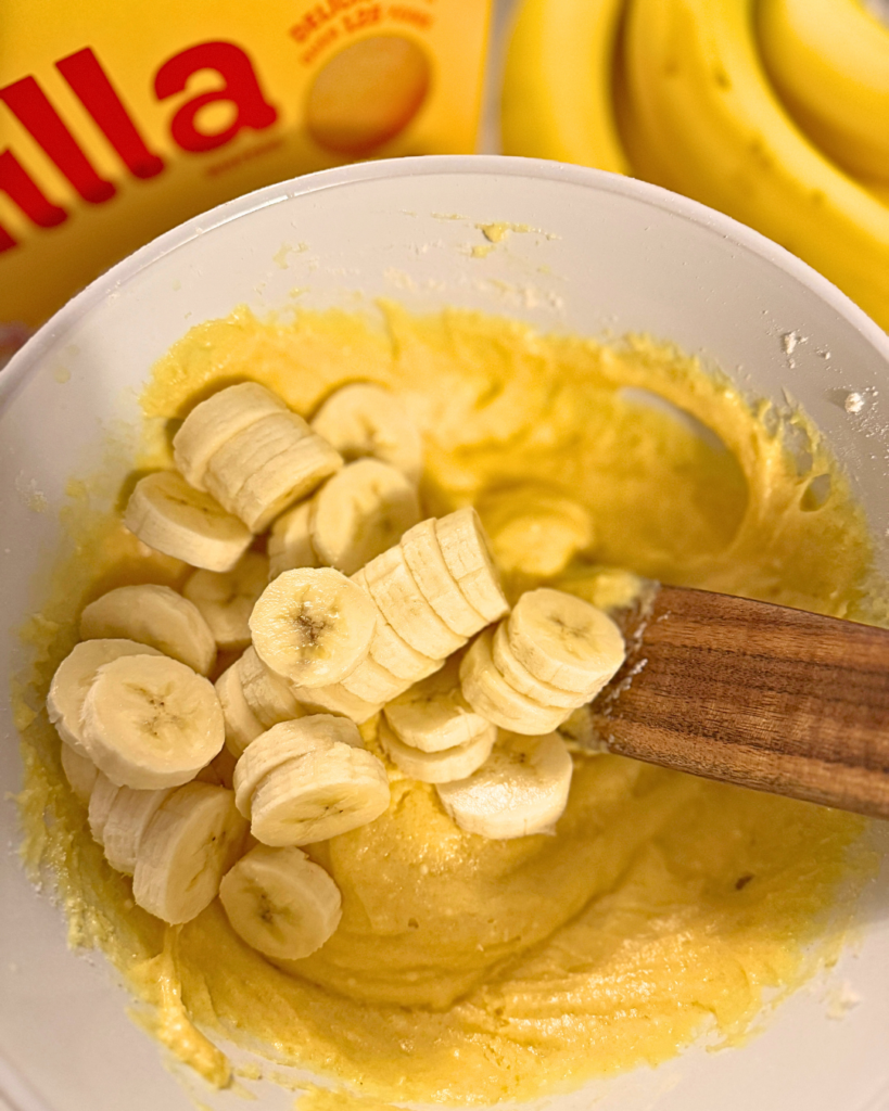 banana pudding brownies being mixed in a mixing bowl